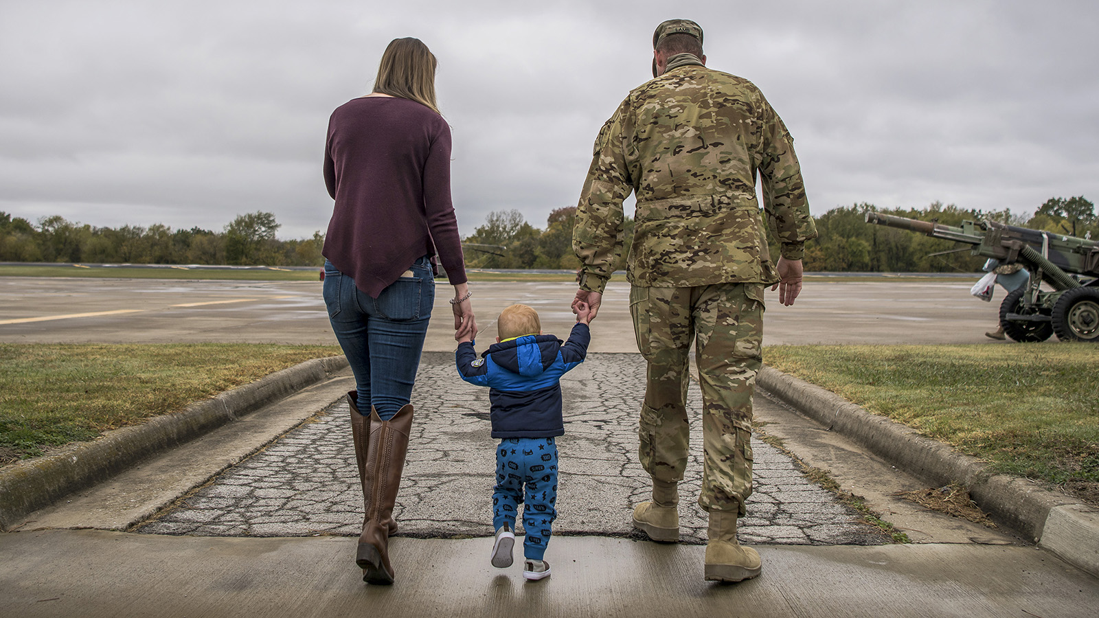 Military family holding hands
