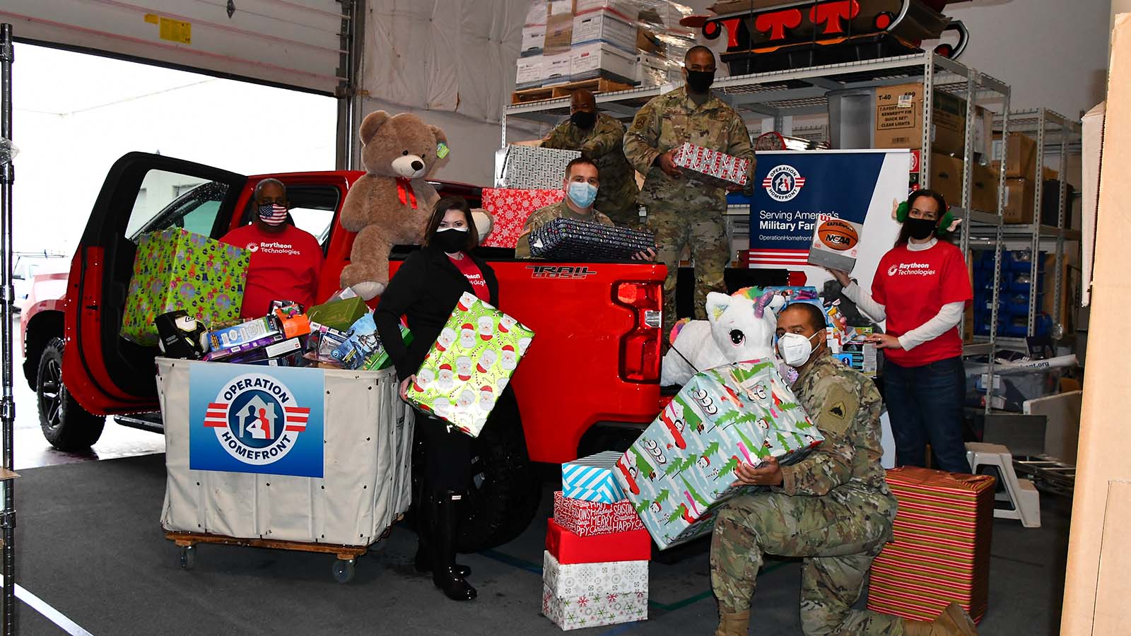 Raytheon Technologies volunteer with service members to help with Operation Homefront's Holiday Toy Drive.