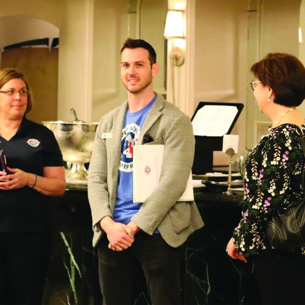 Three members of a nonprofit at a career conference.