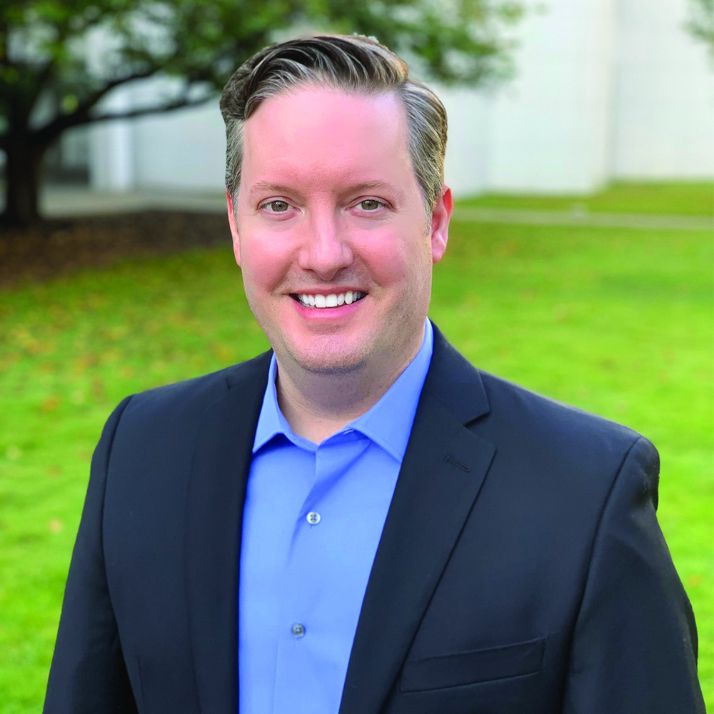 Headshot of a smiling marketing professional.