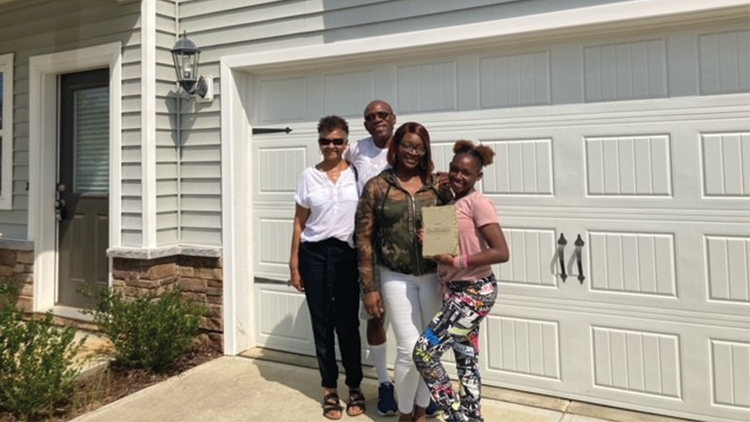 Family receives home through housing program.