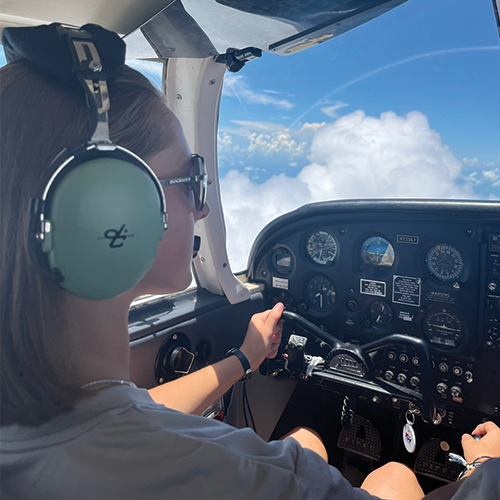 girl flying a plane