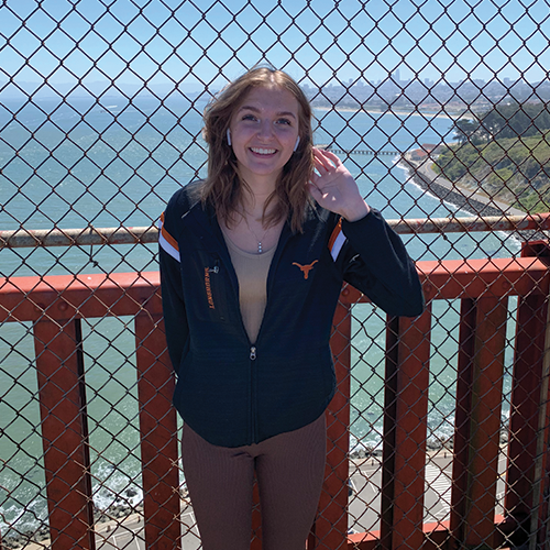 Girl standing on a bridge