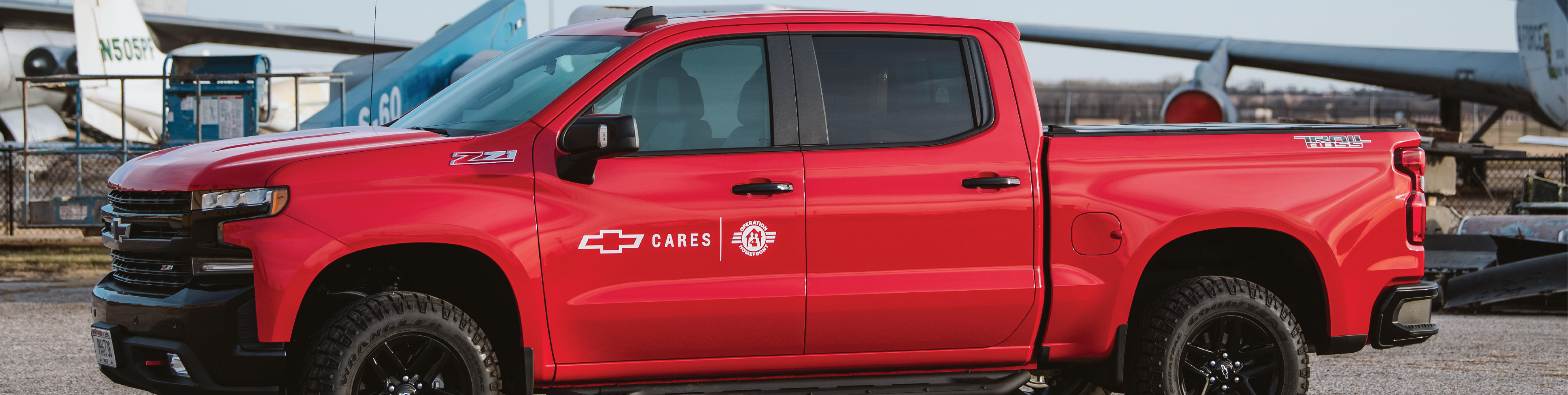 red chevy truck with operation homefront logo