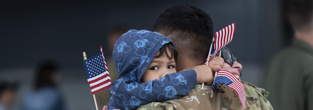 https://operationhomefront.org/wp-content/uploads/2023/09/DVIDS-kid-hugging-dad-homepage-1903x670-1-1024x361-1.png