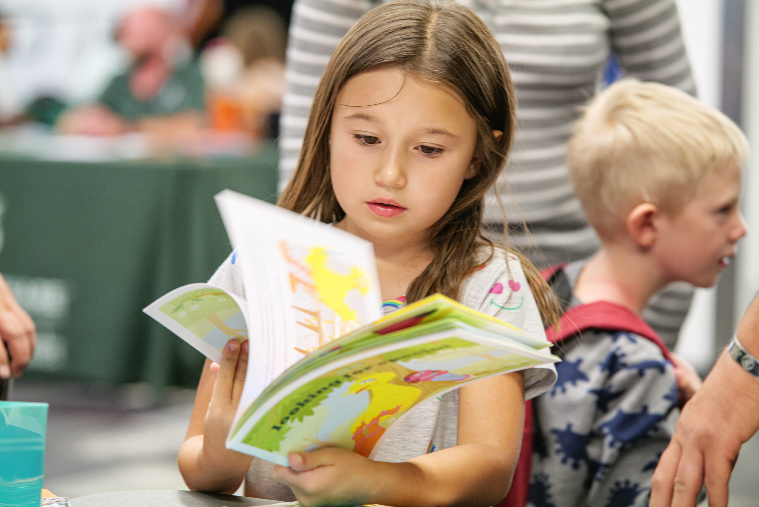 girl flipping through a book